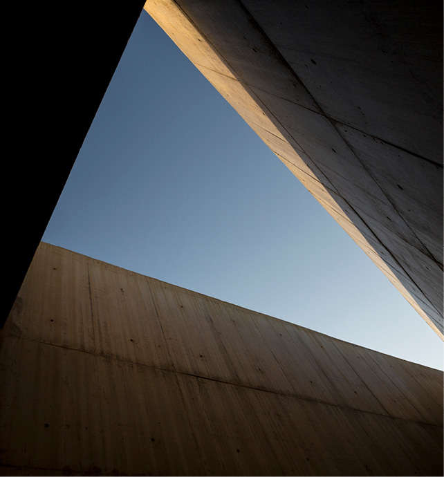 A low angle view of a building with blue sky above