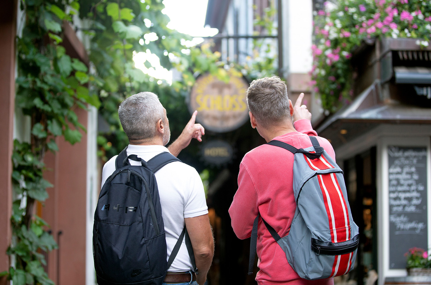 Two men exploring a small village off the river cruise