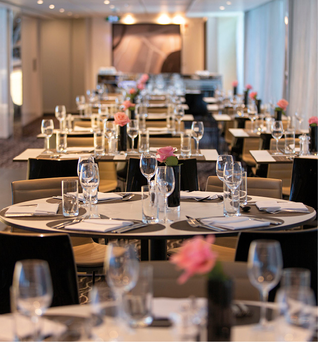 Tables set ready for dinner on board a luxury river ship