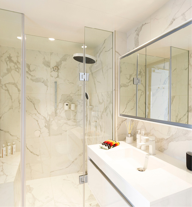 A white marble bathroom with luxurious ESPA toiletries and Missoni towels on board an Emerald Cruises yacht