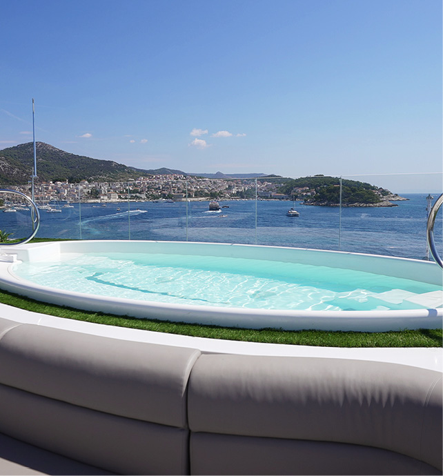 The Spa Pool on the top deck of an Emerald Cruises yacht, looking out over amazing views of the Mediterranean