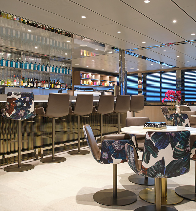 Comfortable seating in the well-stocked bar in the Amici Bar & Lounge on board an Emerald Cruises yacht